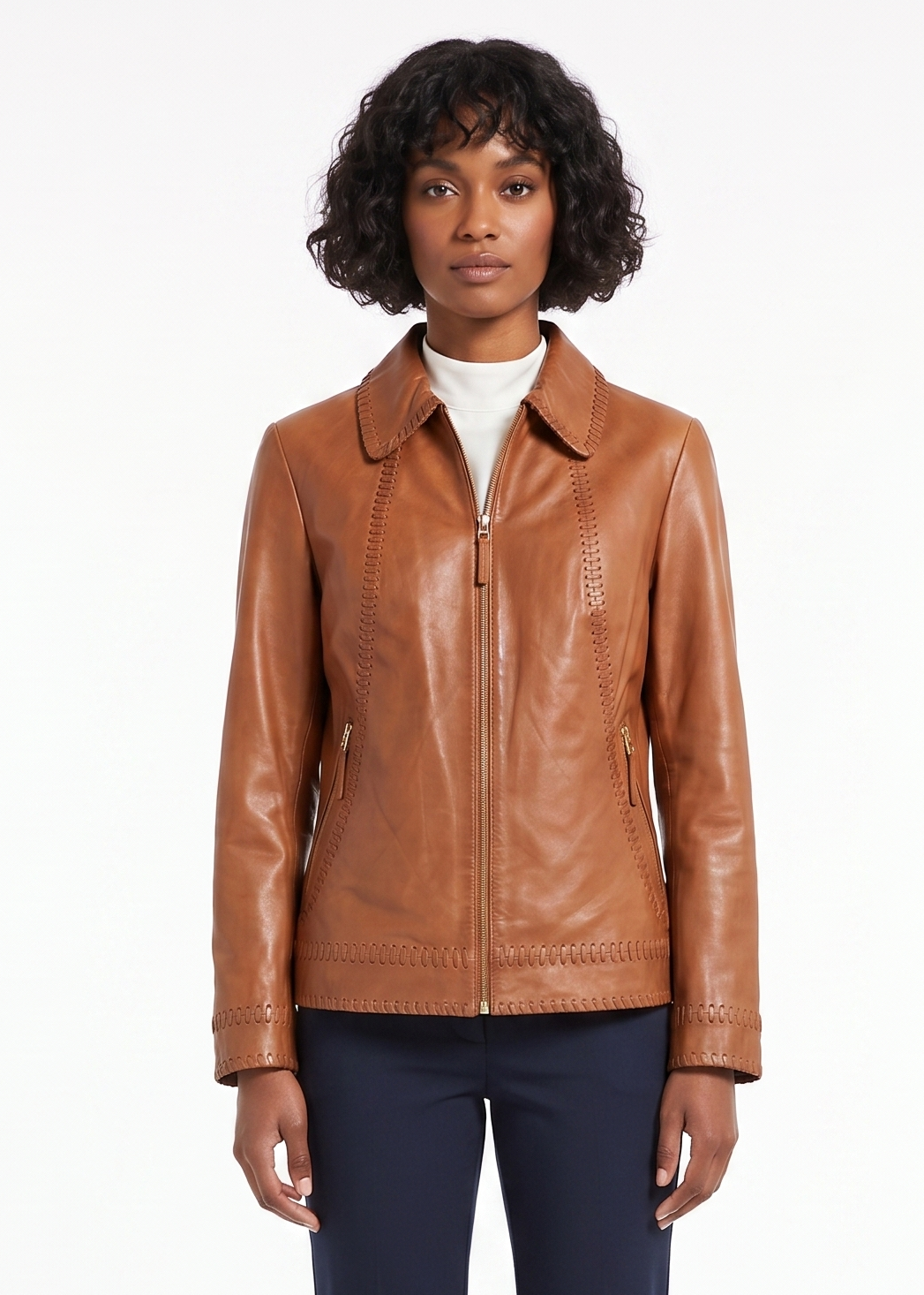 Woman wearing a brown leather jacket on a white background